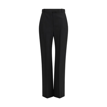 Trousers by Alexander McQueen for women in cotton black features a tailored silhouette with a tailored straight-leg & regular-fit, defined by its long and a sophisticated .