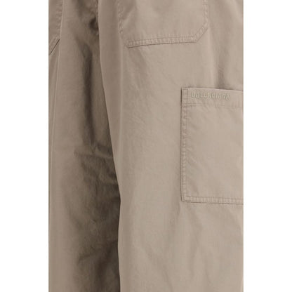 Trousers by Balenciaga for men in cotton twill beige & signature features an sartorial silhouette, showcasing a precise oversized and long with a sartorial for a refined look.
