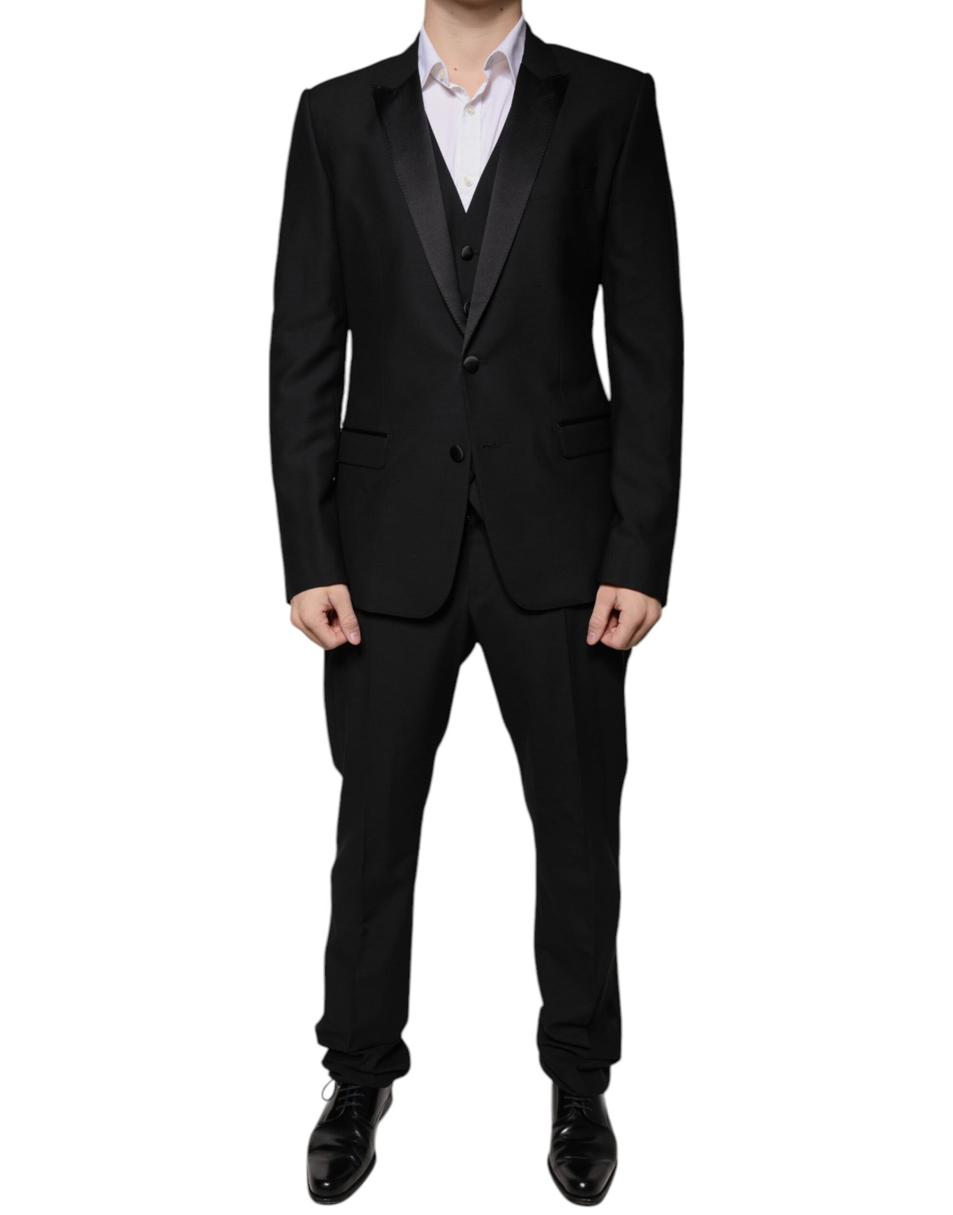 Tuxedo by Dolce & Gabbana for men in virgin wool silk & viscose black features an sharp silhouette with a sharp single-breasted neckline and a sharp slim for a formal look.
