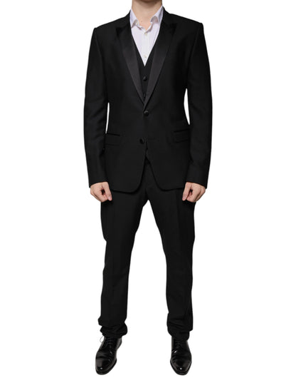 Tuxedo by Dolce & Gabbana for men in virgin wool silk & viscose black features an sharp silhouette with a sharp single-breasted neckline and a sharp slim for a formal look.