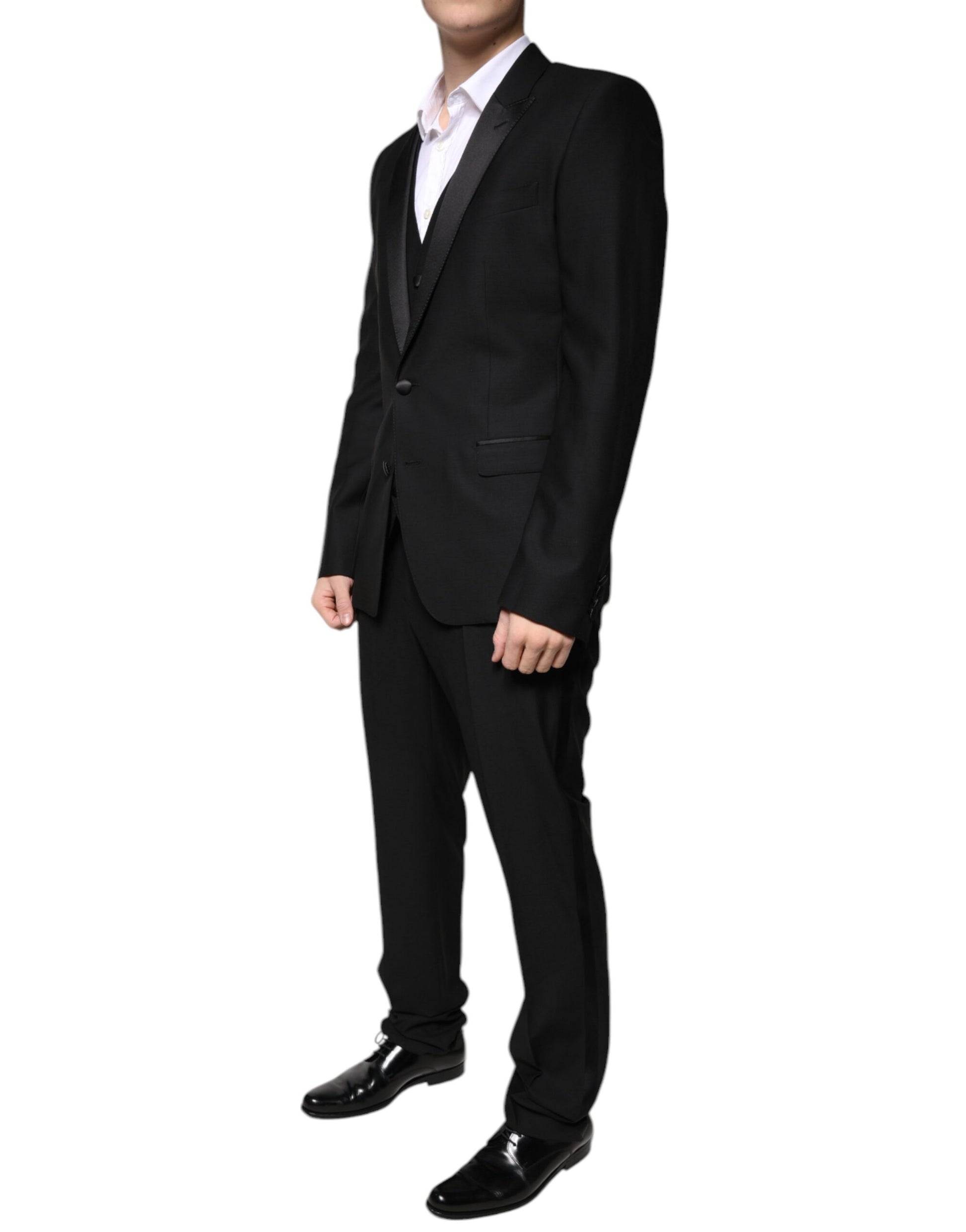 Tuxedo by Dolce & Gabbana for men in virgin wool silk & viscose black features a definitive silhouette, showcasing a sophisticated and definitive slim for a refined, formal look.