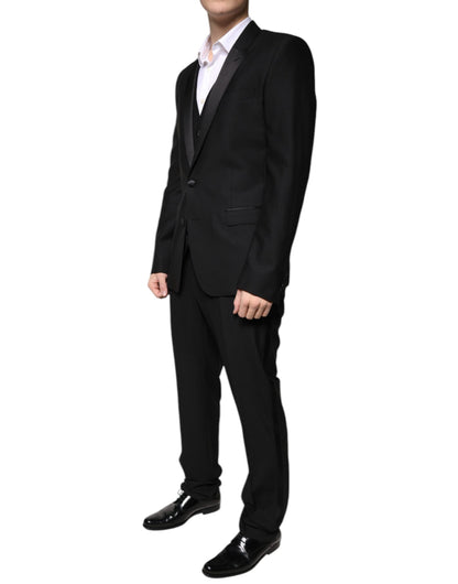 Tuxedo by Dolce & Gabbana for men in virgin wool silk & viscose black features a definitive silhouette, showcasing a sophisticated and definitive slim for a refined, formal look.