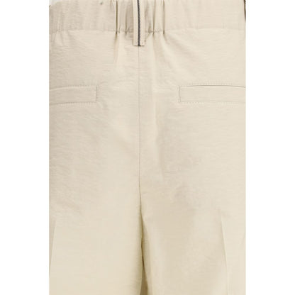 Trousers by Brunello Cucinelli for women in polyamide cotton beige features a tailored silhouette with a tailored regular-fit, defined by its long and a sophisticated .