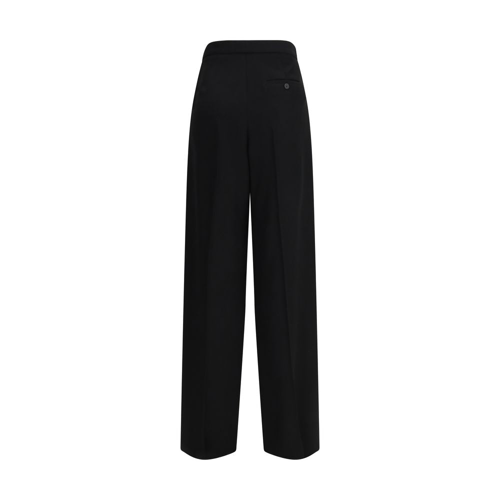Trousers by Balenciaga for women in cotton black presents a smart silhouette, meticulously detailed with a smart regular-fit, a smart long, and a smart .
