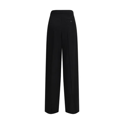 Trousers by Balenciaga for women in cotton black presents a smart silhouette, meticulously detailed with a smart regular-fit, a smart long, and a smart .