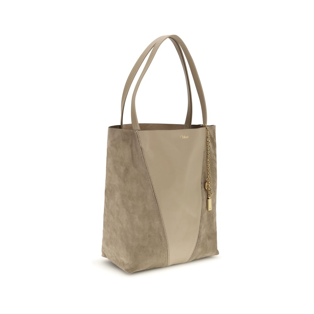 Evening Shoulder Bag by Chloé for women in grained & suede leather beige showcases a enviable silhouette, artfully detailed with a secure , organized , and versatile shoulder-strap & handle for a enviable look.