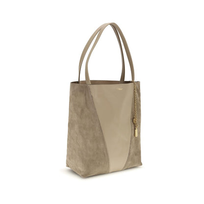 Evening Shoulder Bag by Chloé for women in grained & suede leather beige showcases a enviable silhouette, artfully detailed with a secure , organized , and versatile shoulder-strap & handle for a enviable look.