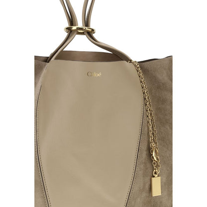 Evening Shoulder Bag by Chloé for women in grained & suede leather beige features a effortless sophistication silhouette, secured by a with ample and versatile shoulder-strap & handle for a effortless sophistication finish.