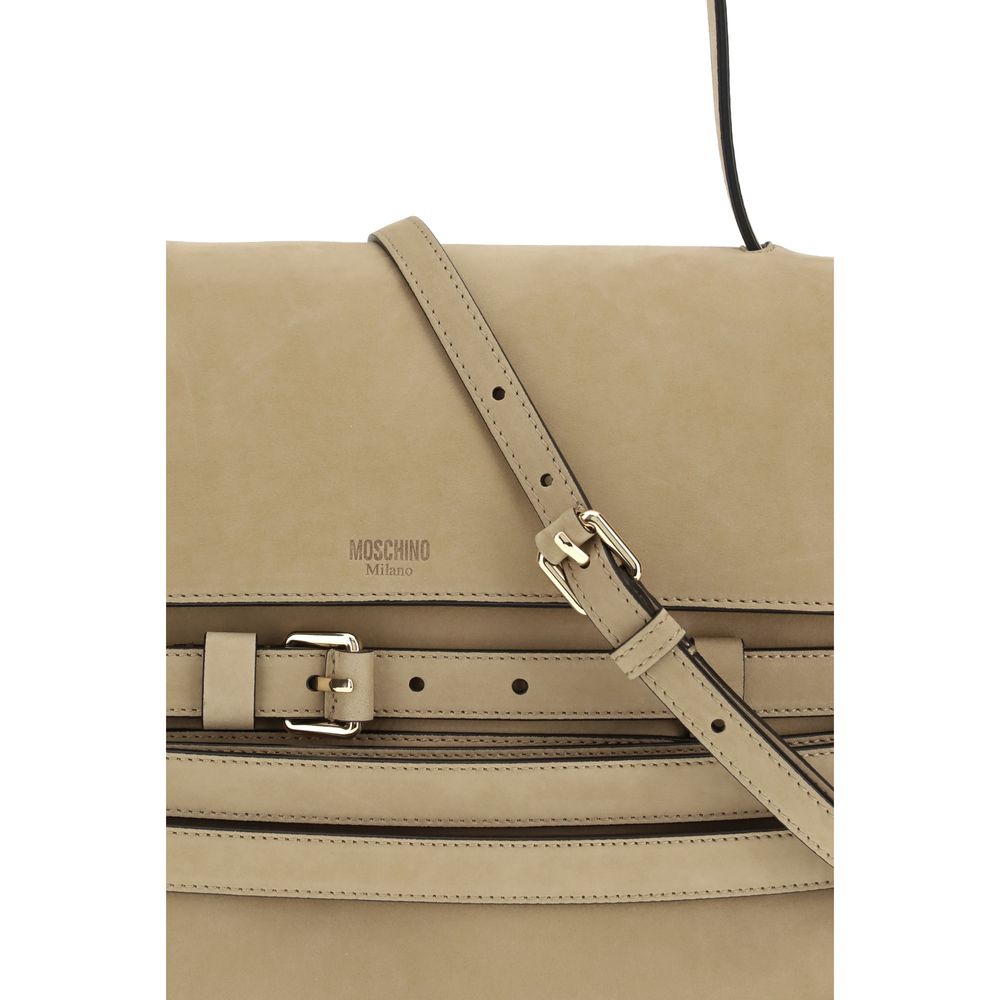 This Flap Handbag by Moschino for women in bos taurus calf nubuck leather and beige & signature presents a sculptural silhouette featuring a secure flap & magnetic, ample , and versatile detachable-strap, belt-strap & handle for a sculptural finish.