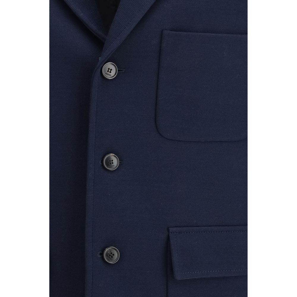 Overcoat by Gucci for men in cotton blue showcases a enveloping silhouette, detailed with distinctive pockets and a enveloping .