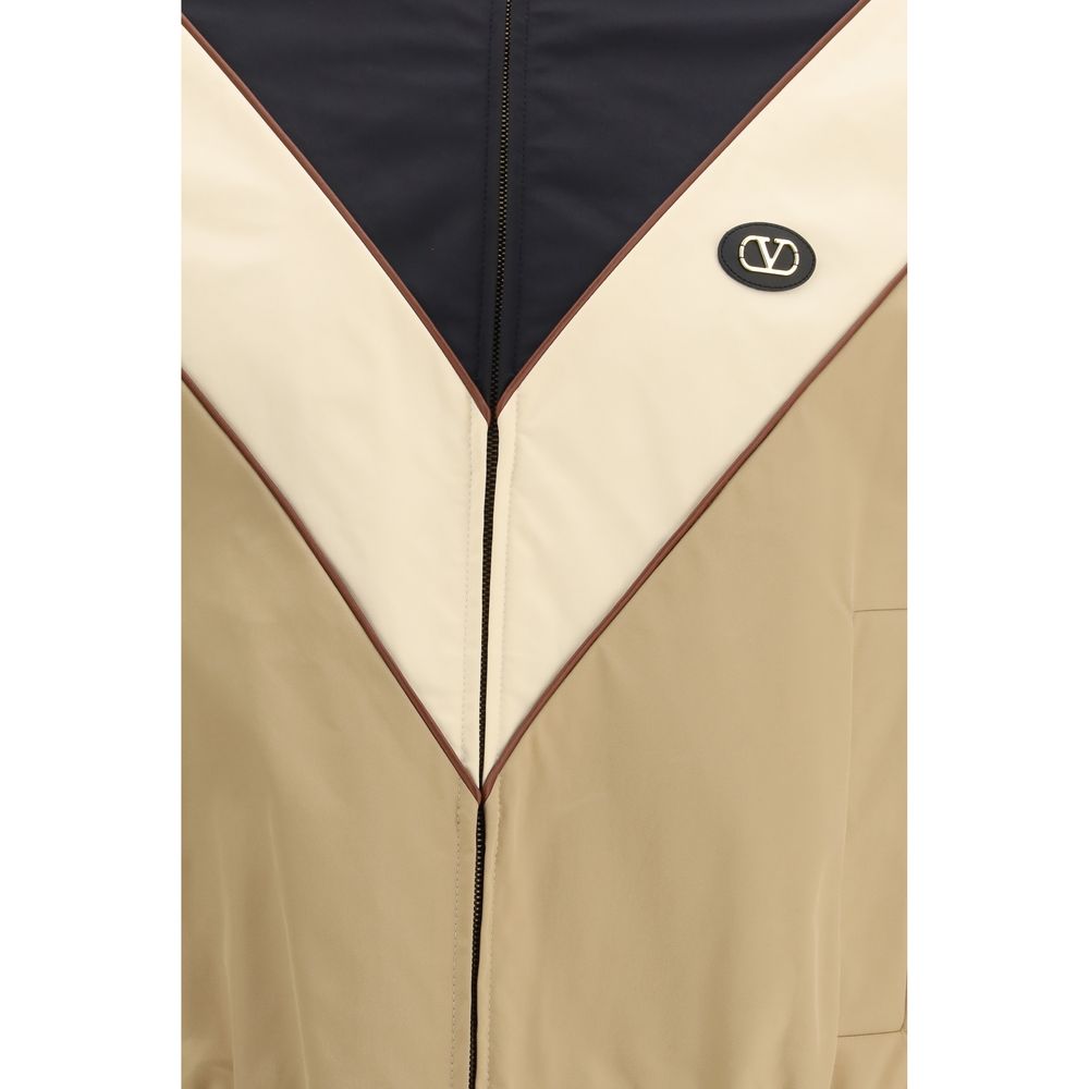 Hooded Windbreaker Jacket by Valentino Garavani for men in nylon & polyester multicolor features an stylish silhouette, showcasing a sophisticated and performance-driven pockets, hooded & windproof for a premium, stylish look.