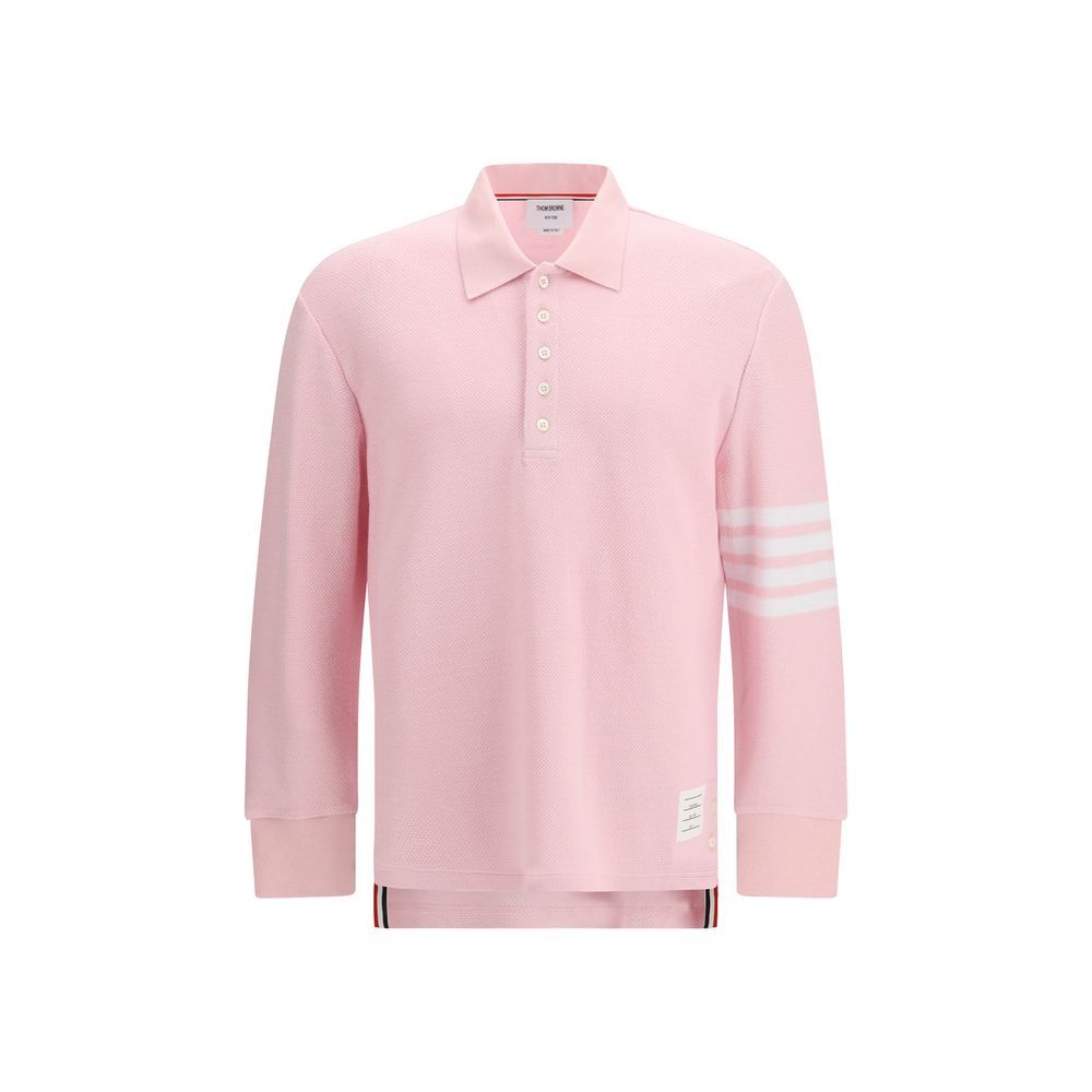 This Polo Shirt by Thom Browne for men in cotton multicolor, signature & striped presents a flawless silhouette, showcasing flawless long-sleeve detailing and a refined for a truly flawless aesthetic.