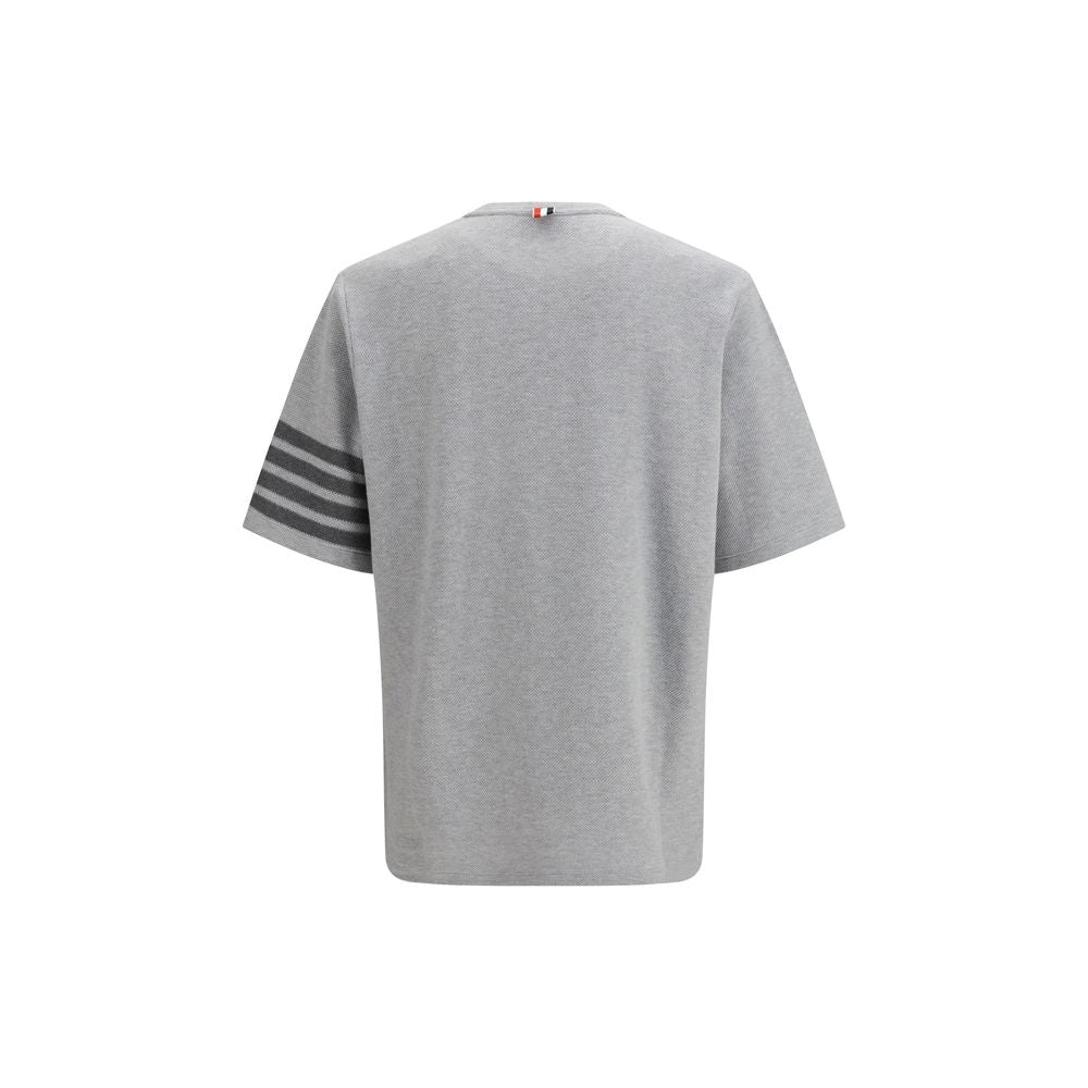 Activewear T-Shirt by Thom Browne for men in cotton gray, signature & striped presents a kinetic silhouette, showcasing the kinetic and crew neckline alongside functional for a premium, athletic look.
