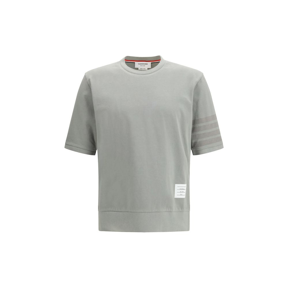 Activewear T-Shirt by Thom Browne for men in cotton gray & signature features a dynamic silhouette with and crew neckline enhanced by functional .