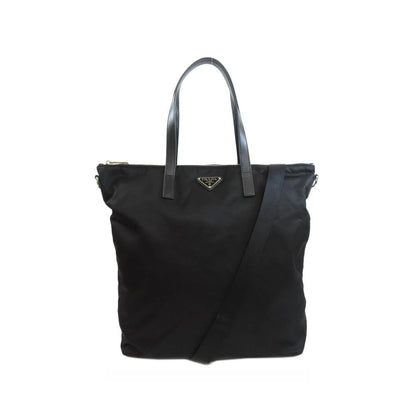 Tote Bag by Prada for women in nylon fabric black showcases a statuesque Nylon Fabric Tote Bag design, featuring a secure zipper, ample , and versatile shoulder-strap & handle for a statuesque finish.