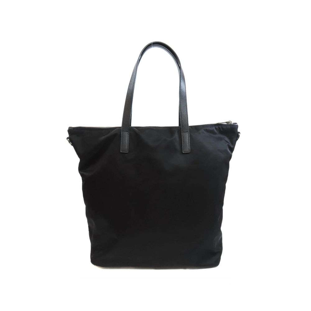 Tote Bag by Prada for women in nylon fabric black features an jet-setting Nylon Fabric Tote Bag design with a secure zipper, jet-setting , and versatile shoulder-strap & handle for a jet-setting look.