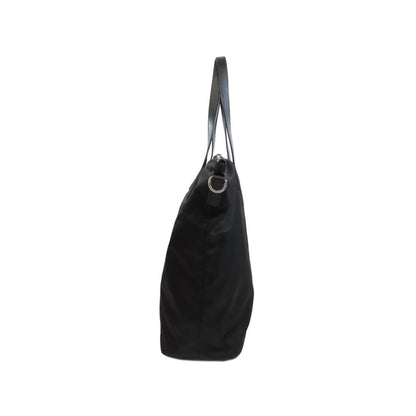 Tote Bag by Prada for women in nylon fabric black features a jet-set sophisticated Nylon Fabric Tote Bag design with a secure zipper, ample , and versatile shoulder-strap & handle for a jet-set sophisticated finish.