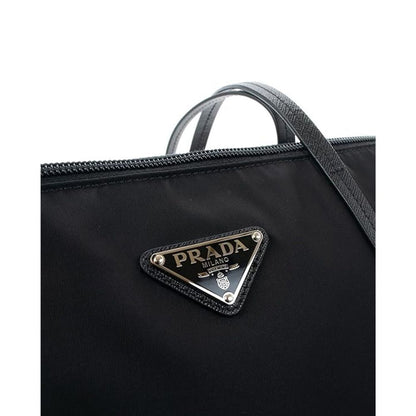 Tote Bag by Prada for women in nylon fabric black features an jet-setting Nylon Fabric Tote Bag design with a secure zipper, jet-setting , and versatile shoulder-strap & handle for a jet-setting look.