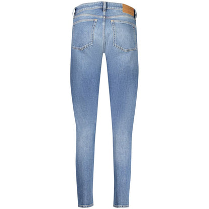 Jeans by Tommy Hilfiger for women in stretch denim cotton blue features a polished silhouette with a polished slim, reaching a polished long and finished with a polished .