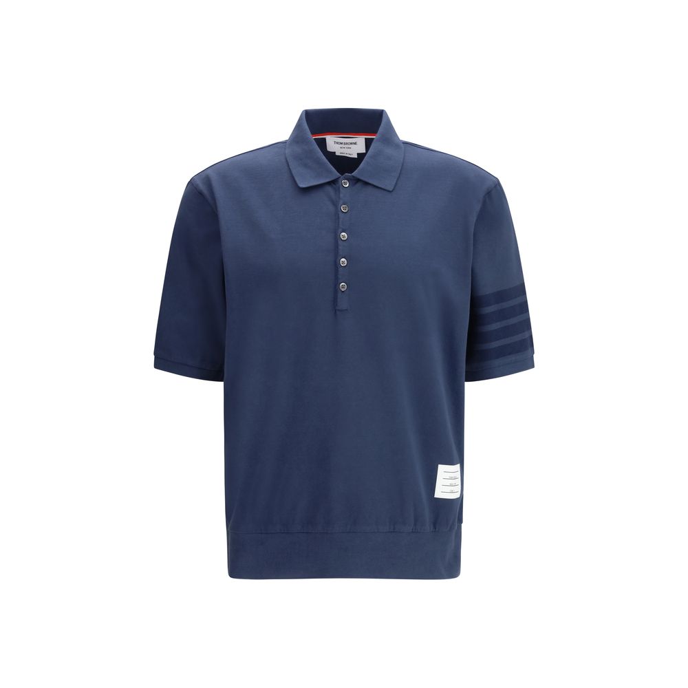 Polo Shirt by Thom Browne for men in cotton blue, signature & striped showcases a sharp silhouette, detailed with a refined and sharp for a sophisticated finish.