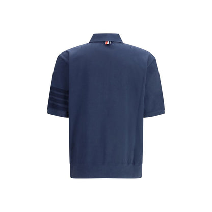 Polo Shirt by Thom Browne for men in cotton blue, signature & striped presents a distinguished silhouette, showcasing a sophisticated and distinguished for a truly distinguished finish.
