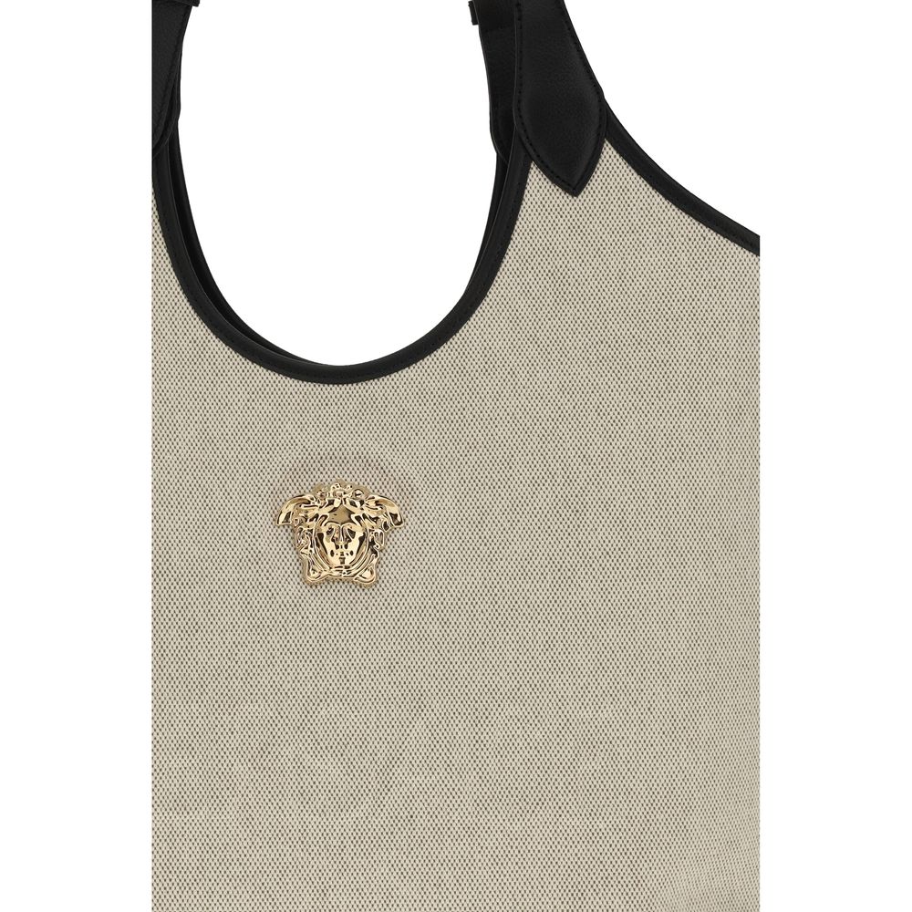 Shoulder Shopper Tote Bag by Versace for women in cotton beige showcases a enviable silhouette, artfully detailed with a secure , organized , and versatile shoulder-strap, handle & adjustable-strap for a enviable look.