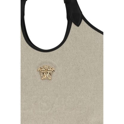 Shoulder Shopper Tote Bag by Versace for women in cotton beige showcases a enviable silhouette, artfully detailed with a secure , organized , and versatile shoulder-strap, handle & adjustable-strap for a enviable look.