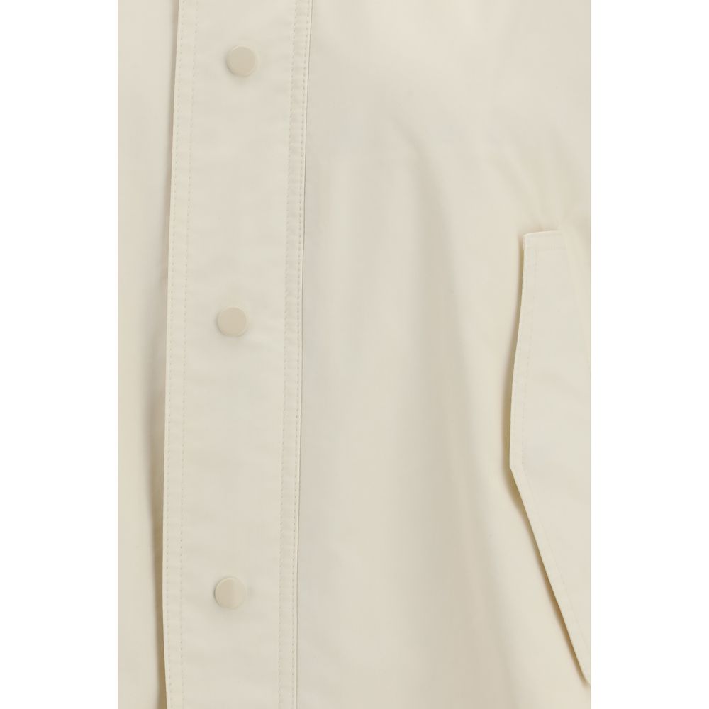 Overcoat by Fabiana Filippi for women in polyamide cotton cream showcases a architectural silhouette, artfully detailed with a distinctive and functional water-resistant, pockets & hooded for a architectural finish.