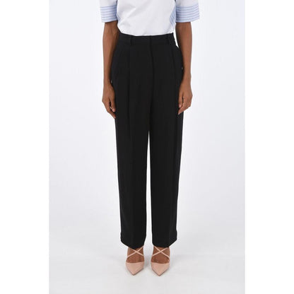 Casual Pants by Tory Burch for women in acetate black presents a refined pantology silhouette, artfully defined by a refined pantology , long, and a sophisticated high rise.