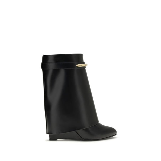 Wedge Ankle Boots by Givenchy for women in bos taurus calf leather black & gold features an avant-garde Women's Bos Taurus Calf Leather Wedge Ankle Boots silhouette, defined by a sophisticated wedge and a avant-garde pointed toe style.