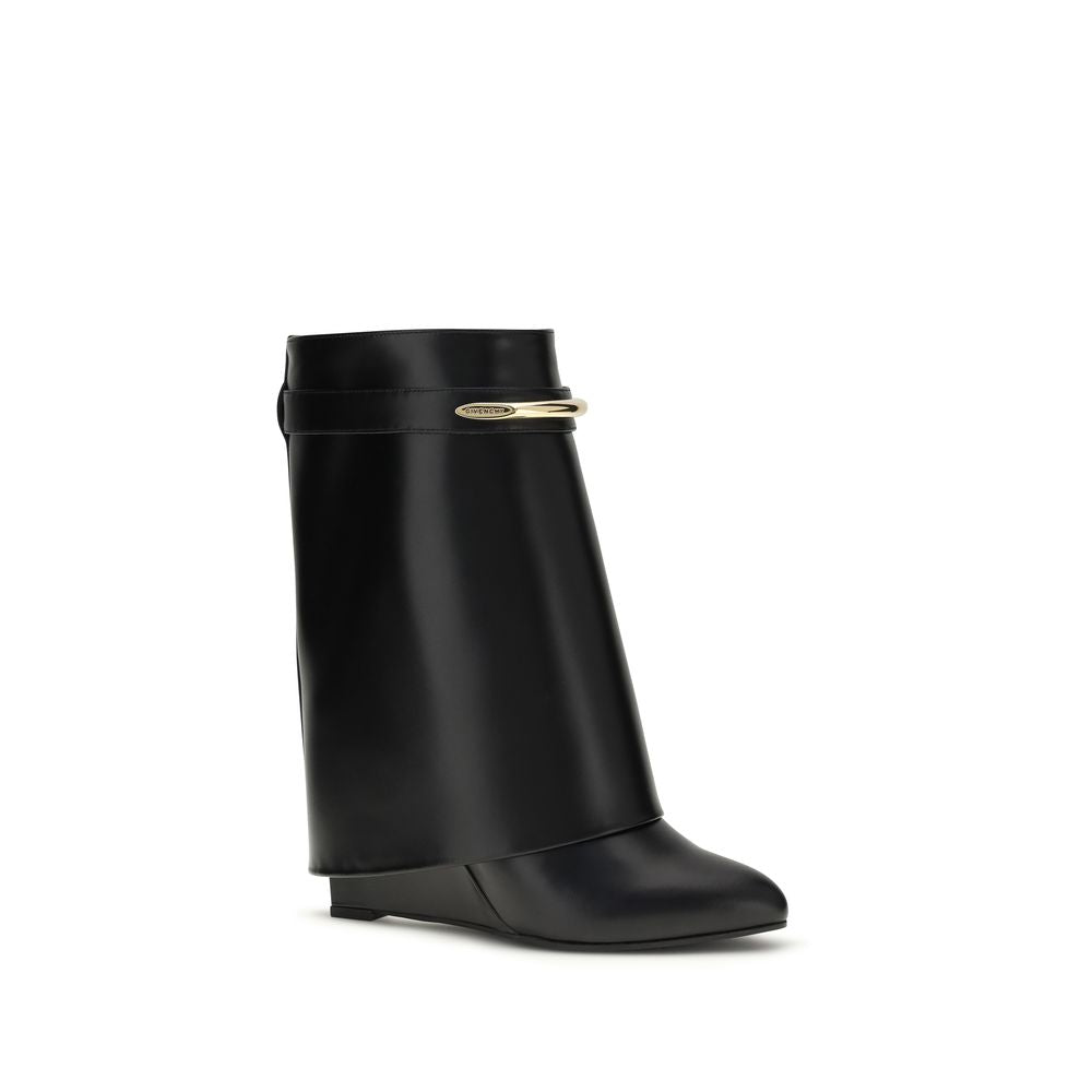 Wedge Ankle Boots by Givenchy for women in bos taurus calf leather black & gold features an effortless chic silhouette from the Women's Bos Taurus Calf Leather Wedge Ankle Boots collection, showcasing a effortless chic wedge and refined pointed toe style for an effortless chic look.