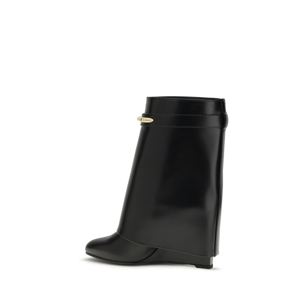 Wedge Ankle Boots by Givenchy for women in bos taurus calf leather black & gold showcases a ergonomic silhouette from the Women's Bos Taurus Calf Leather Wedge Ankle Boots collection, featuring a ergonomic wedge and a ergonomic pointed toe style.