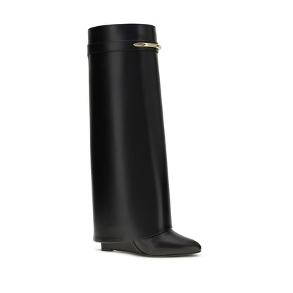 Wedge Boots by Givenchy for women in bos taurus calf leather black & gold features an effortless chic silhouette from the Women's Bos Taurus Calf Leather Wedge Boots collection, showcasing a effortless chic wedge and refined pointed toe style for an effortless chic look.