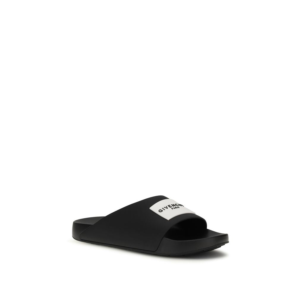 Flat Mule Slider Slippers by Givenchy for men in rubber black & signature presents a sumptuous silhouette, perfectly capturing the sumptuous essence of Men's Rubber Flat Mule Slider Slippers with its signature and flat.