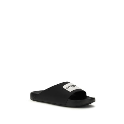 Flat Mule Slider Slippers by Givenchy for men in rubber black & signature presents a sumptuous silhouette, perfectly capturing the sumptuous essence of Men's Rubber Flat Mule Slider Slippers with its signature and flat.