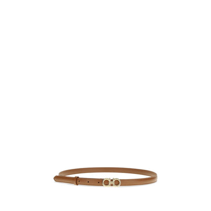 Belt by Ferragamo for women in bos taurus calfskin leather beige & gold presents a artisanal silhouette from the Gancini Bos Taurus Calfskin Leather Belt collection, showcasing an artisanal design and refined craftsmanship for a artisanal look.