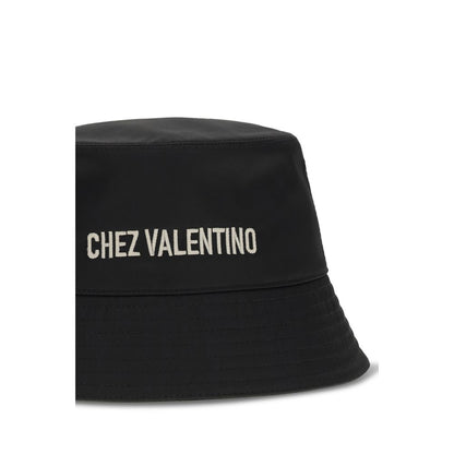 Bucket Hat by Valentino Garavani for men in cotton polyester black showcases a effortlessly chic silhouette, artfully capturing the essence of the effortlessly chic Cotton Polyester Bucket Hat design for a sophisticated look.