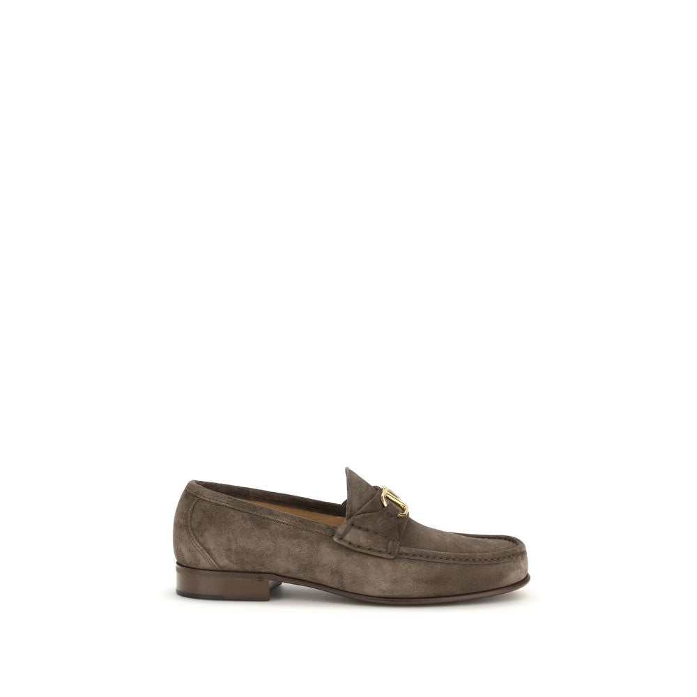 This Loafer Slip-On Shoes by Valentino Garavani for men in bos taurus calf leather brown & signature features an exquisite silhouette from the V Logo Men's Bos Taurus Calf Leather Loafer Slip-On Shoes collection, defined by a sophisticated and elegant .