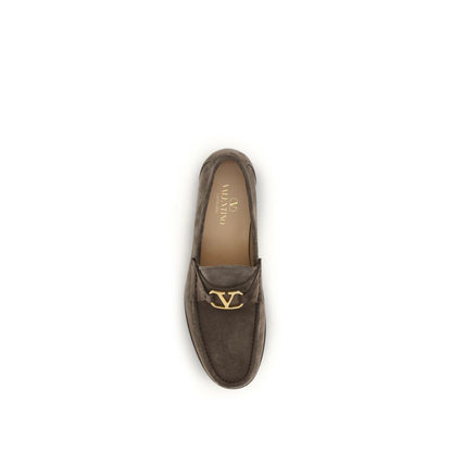 Loafer Slip-On Shoes by Valentino Garavani for men in bos taurus calf leather brown & signature showcases a timeless silhouette from the V Logo Men's Bos Taurus Calf Leather Loafer Slip-On Shoes collection, featuring a timeless and for a timeless finish.