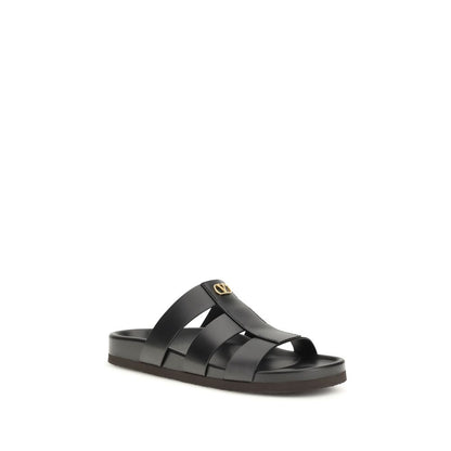 Slider Cage Sandals by Valentino Garavani for men in bos taurus calfskin leather black & signature features an exquisite silhouette, showcasing the exquisite V Logo Men's Bos Taurus Calfskin Leather Slider Cage Sandals with a and .