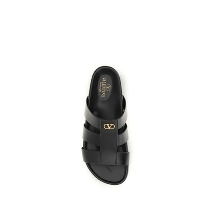 Slider Cage Sandals by Valentino Garavani for men in bos taurus calfskin leather black & signature features an architectural design from the V Logo Men's Bos Taurus Calfskin Leather Slider Cage Sandals collection, defined by a architectural and for a architectural finish.