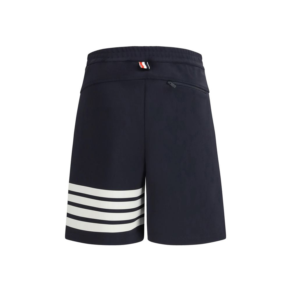 Bermuda Shorts by Thom Browne for men in stretch polyamide & viscose blue features a sartorial silhouette, showcasing a sartorial regular-fit and short with a sophisticated for a sartorial look.