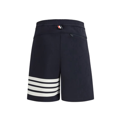 Bermuda Shorts by Thom Browne for men in stretch polyamide & viscose blue features a sartorial silhouette, showcasing a sartorial regular-fit and short with a sophisticated for a sartorial look.