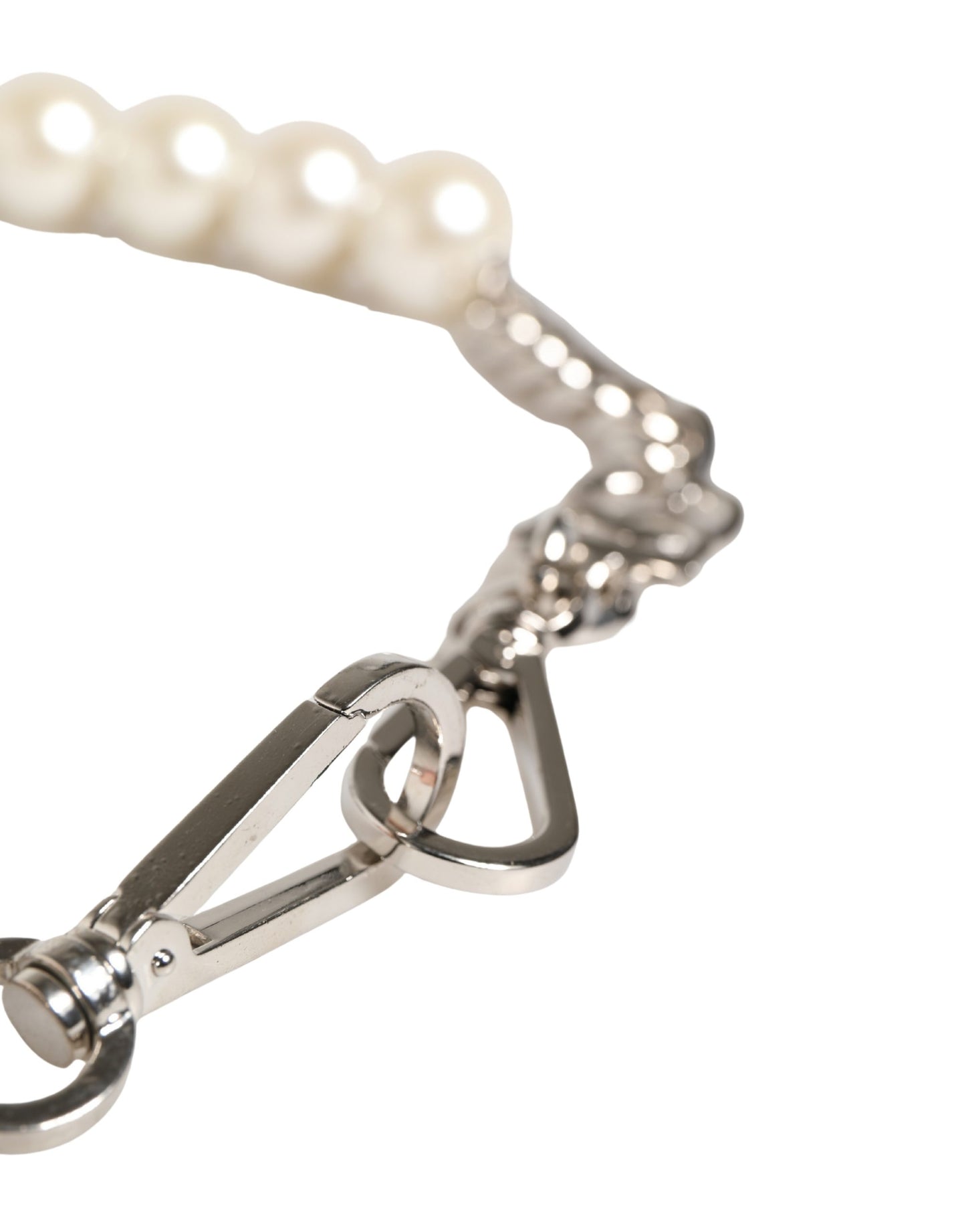 Shoulder Strap by Dolce & Gabbana for women in brass zamak & calf leather black, pearl, silver & white features a dynamic silhouette, artfully enhancing the dynamic design of this Brass Zamak Calf Leather Shoulder Strap.