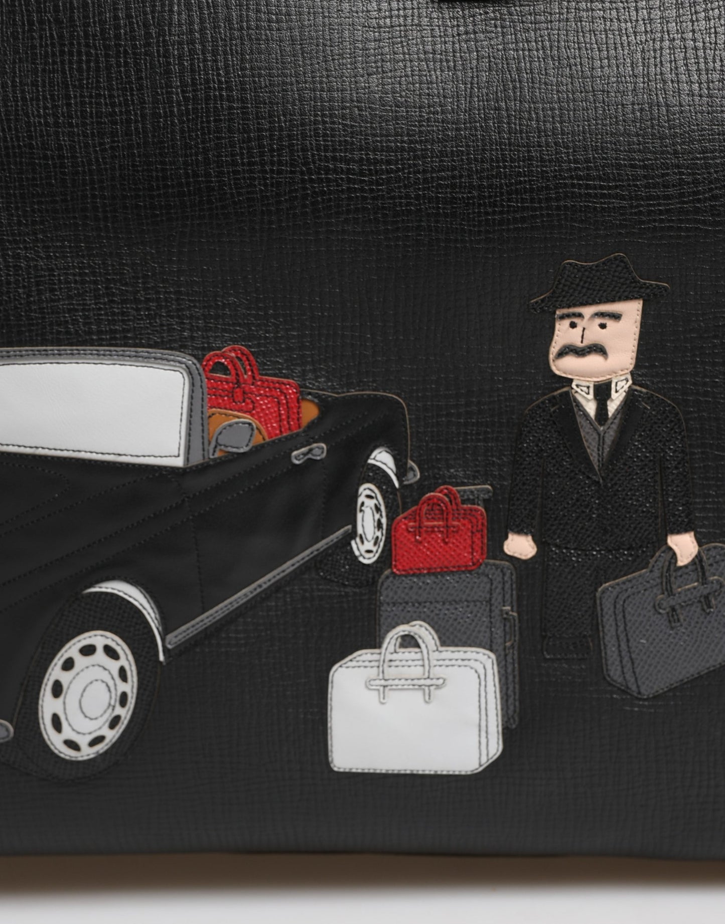 Weekender Convertible Handbag by Dolce & Gabbana for unisex in calf leather black presents a enviable design with a secure zipper, ample laptop-compartment, and versatile for a sophisticated look.