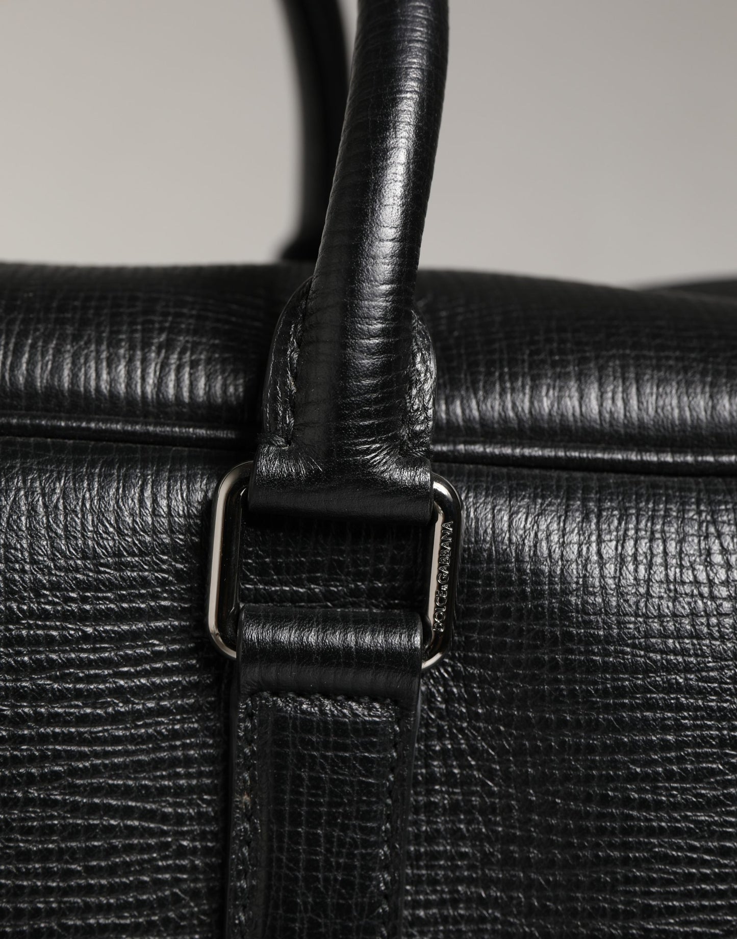 Weekender Convertible Handbag by Dolce & Gabbana for unisex in calf leather black features an exquisite silhouette, showcasing a secure zipper, ample laptop-compartment, and exquisite for a sophisticated finish.