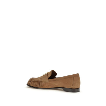 Flat Loafer Slip-On Shoes by Fendi for women in bos taurus suede calf leather brown features an effortless chic silhouette, showcasing the Women's Bos Taurus Suede Calf Leather Flat Loafer Slip-On Shoes design with an effortless chic flat and a round toe style for a effortless chic look.