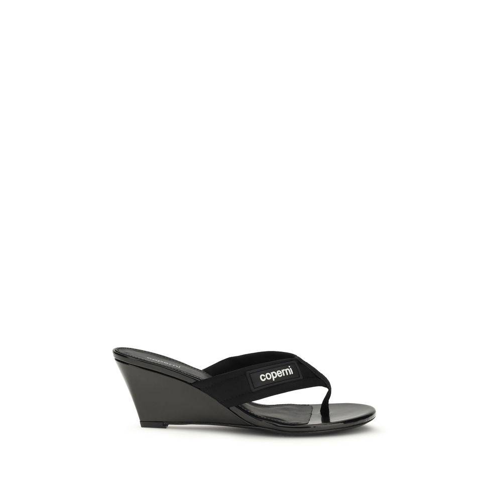 Wedge Flip-Flop Sandals by Coperni for women in polyamide black presents a sculptural silhouette, showcasing the Women's Polyamide Wedge Flip-Flop Sandals design with a sculptural wedge and for a premium look.