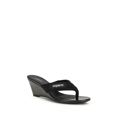 Wedge Flip-Flop Sandals by Coperni for women in polyamide black showcases a sculptural silhouette as Women's Polyamide Wedge Flip-Flop Sandals, defined by a sculptural wedge and sculptural for a sculptural look.