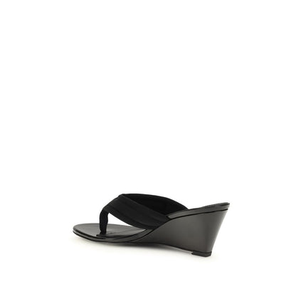Wedge Flip-Flop Sandals by Coperni for women in polyamide and black presents a captivating silhouette, showcasing the signature style of the Women's Polyamide Wedge Flip-Flop Sandals with a captivating wedge and captivating .